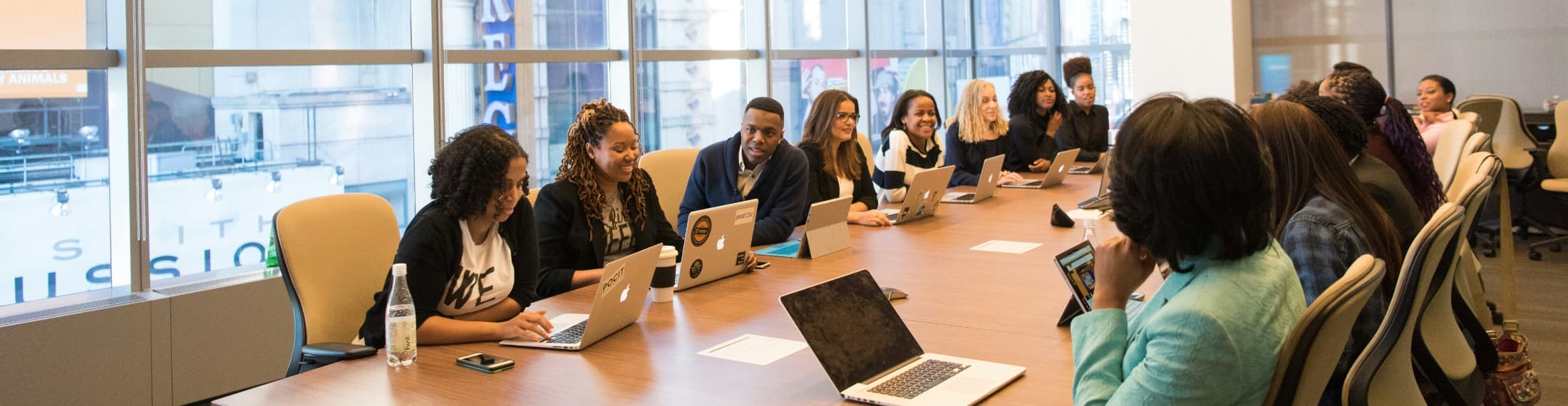 diverse group of people around a large conference table