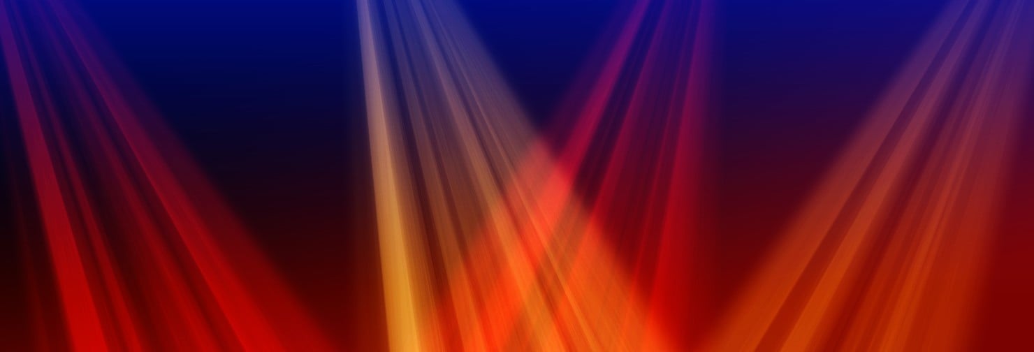 Abstract red, orange, and blue light beams for the Winter 2026 hero image