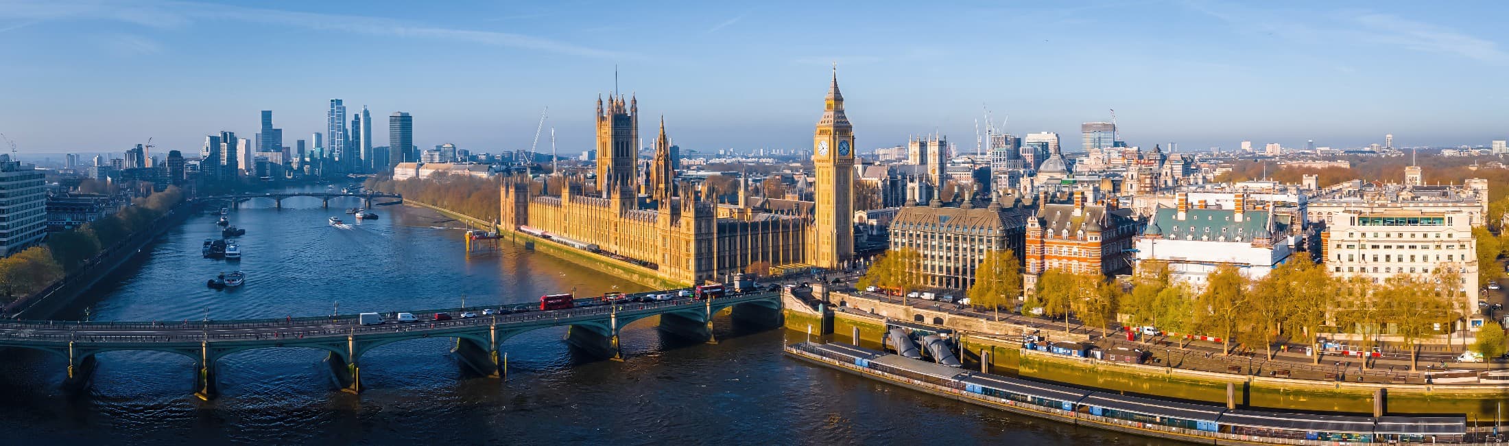 London cityscape with the River Thames and the Houses of Parliament, representing a major global financial center.