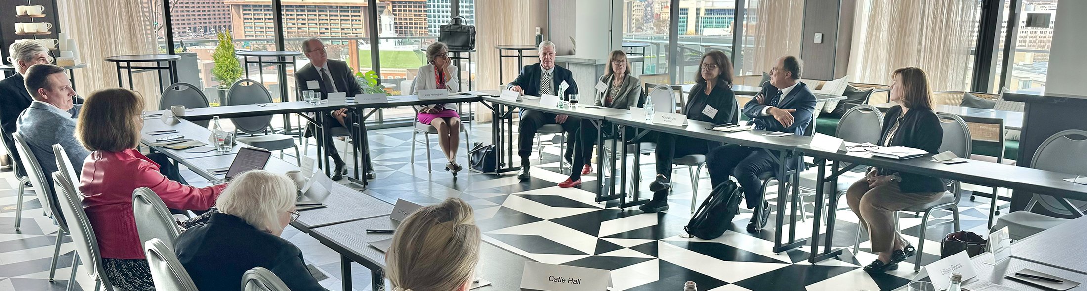 NACD employees sitting at a table having a discussion